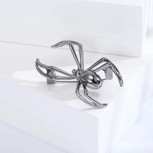 Polished gunmetal spider brooch macro view showcasing realistic details and metal texture