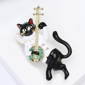 Creative enamel cat brooch playing golden cello with musical notes on white background