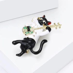Creative enamel cat playing instrument brooch pin on white geometric display stand