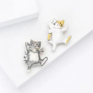 Set of two cute dancing cat enamel pins in grey and white alloy for women