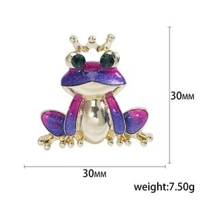 Cute purple crown frog brooch with glitter enamel finish and green gemstone eyes