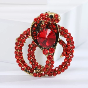 Golden cobra snake brooch with red rhinestones and large central ruby crystal inlay