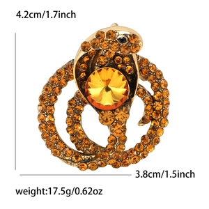Luxurious gold snake brooch with amber rhinestones and crystal measuring 4.2cm x 3.8cm