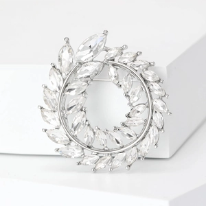 Broche couronne branche d'olivier élégante en strass argentés et cristaux marquise
