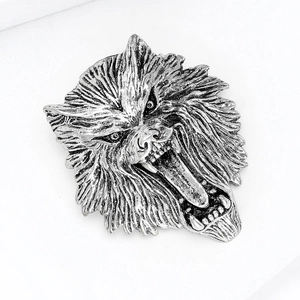 Detailed view of the intricately carved silver lion head brooch with textured mane