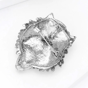 Detail view of vintage silver lion brooch back showing safety pin and dual-purpose hook
