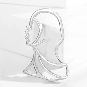 Spilla astratta con profilo viso in argento in stile artistico minimalista per abiti