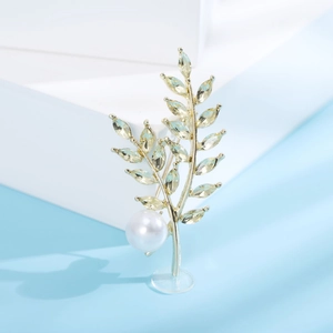 Spilla elegante a spiga di grano dorata con cristalli champagne e una perla bianca