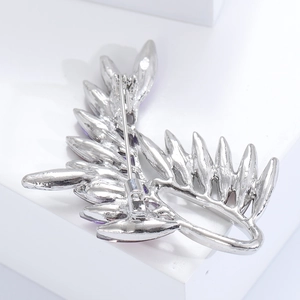 Detail view of the silver olive branch brooch back with safety rotating pin clasp