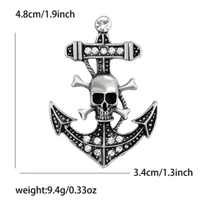 Detail view of vintage anchor brooch with skull motif and rhinestone inlays for suits