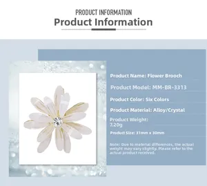Detail view of flower brooch with white petals and crystal centerpiece, size 31mm by 30mm