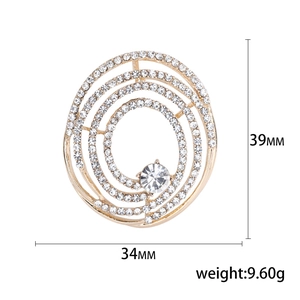 Élégante broche spirale dorée avec strass et cristal central pour costumes et robes, 39x34mm