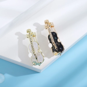 Broches de violon exquises avec strass et émail dans les couleurs noir et or blanc