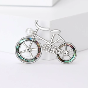 Elegant silver bicycle brooch with pearl, crystals and colorful abalone shell inlay