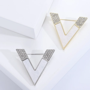 Fashionable V-shaped brooch pins with sparkling rhinestones and white shell inlay accents