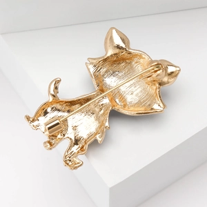 Detailed back view of golden cat brooch showing secure horizontal pin clasp and metal texture
