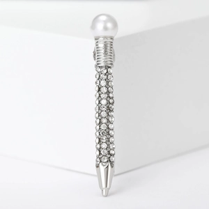 Creative pen-shaped brooch with white pearl and rhinestone inlays on metal base