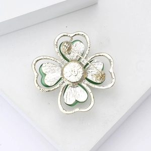 Elegant silver alloy clover brooch with green opal stones and secure metal clasp back