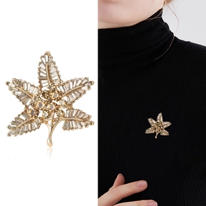 Baroque maple leaf brooch with sparkling amber and clear crystals on golden metal base