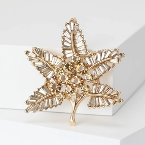 Golden Baroque maple leaf brooch with baguette-cut crystals and amber stones