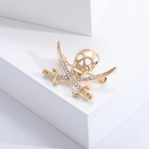 Detail view of pirate skull and crossed swords brooch with white crystal rhinestones