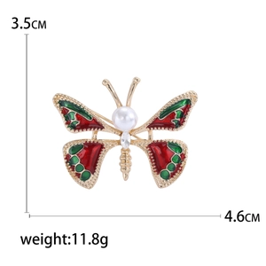 Broche papillon élégante en émail rouge avec perle et cristal, taille 4,6x3,5 cm