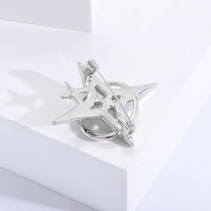 Detailed back view showing the secure pin lock on the silver star-shaped metal brooch