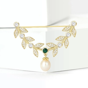Elegant gold leaf brooch with green gemstone, white zircon and hanging pearl accessory