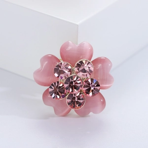 Elegant pink rhinestone flower brooch with opal heart petals and gold plated base