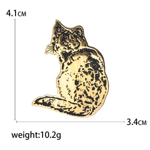 Golden stainless steel cat brooch pins with black enamel detailing and size measurements