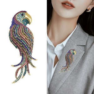 Sparkling parrot brooch with colorful rhinestones on a vintage gold alloy base