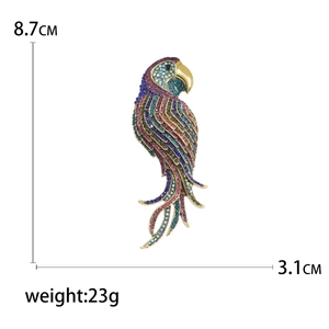 Detailed view of colorful rhinestone parrot brooch with dimensions 8.7cm and 3.1cm