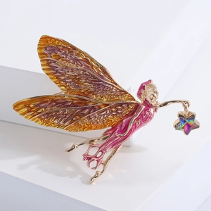 Élégante broche fée dorée avec ailes ambrées en émail rose et cristal d'étoile