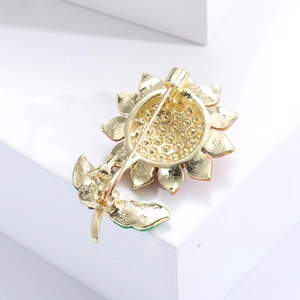 Detailed back view of enamel sunflower brooch showing gold plating and metal pin clasp