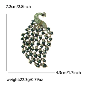 Elegant vintage peacock brooch with green rhinestones and dimensions for suits and coats