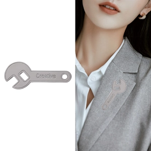 Creative silver wrench brooch pin for suits with polished metallic finish and engraving