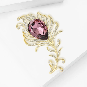 Elegant peacock feather brooch with purple drop crystal and shimmering pavé diamonds