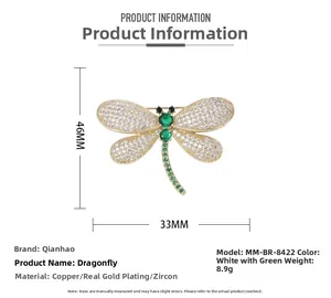 Macro view of a 46x33mm dragonfly brooch made of copper with green and white zircons
