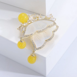 Elegant 3D butterfly brooch with mother of pearl and yellow beads on gold plating