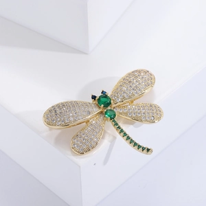 Exquisite gold dragonfly brooch with green gemstones and cubic zirconia wings