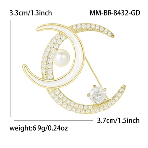 Elegant gold double crescent moon brooch with white enamel, rhinestones and a center pearl
