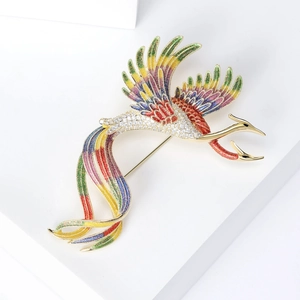 Macro detail of elegant phoenix brooch with colorful enamel gradient and pavé zircons