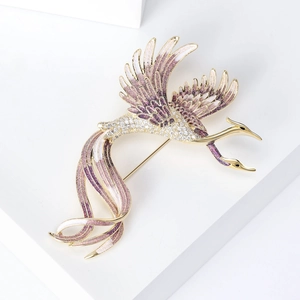 Detailed macro view of the gradient enamel phoenix brooch with sparkling zircon inlays