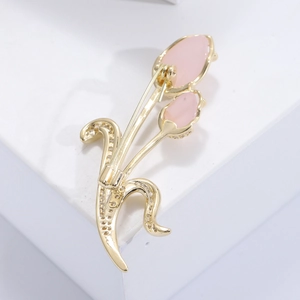 Luxurious tulip flower brooch in gold with pink petals and sparkling crystals for women