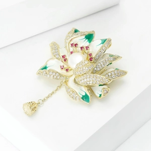 Exquisite lotus brooch in gold enamel with white pearl and a hanging lotus seedpod charm