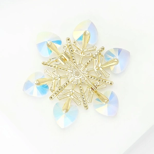 Golden snowflake brooch with iridescent heart crystals and micro-pave diamonds