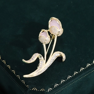 Detail of elegant twin tulip brooch with pink opal stones and sparkling zircon inlay
