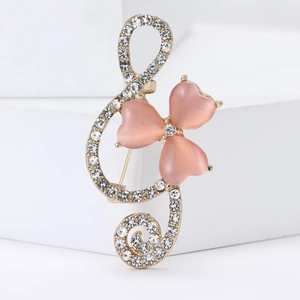 Elegant gold treble clef brooch with pink heart opal stones and crystal rhinestones