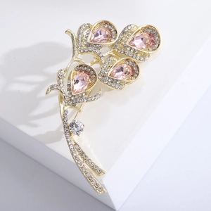 Detail of flower fountain brooch with pink teardrop crystals and pave diamonds