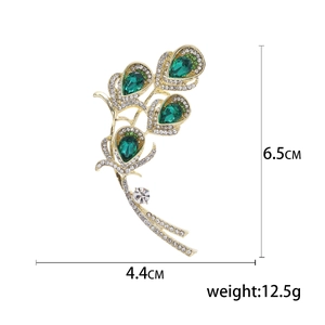 Peacock feather brooch with emerald crystals and rhinestones, size 6.5cm x 4.4cm